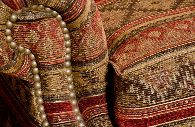 Hand-Woven Tapestries adorning a cozy sofa in a living room setting.